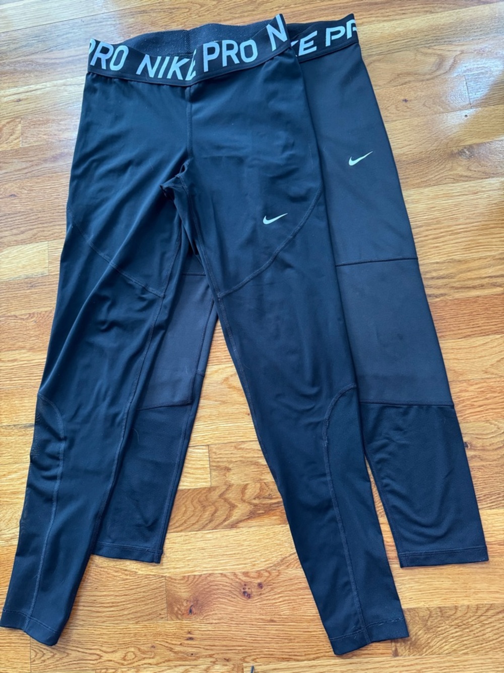 Nike woman’s Black Pro Compression Leggings with White Swoosh